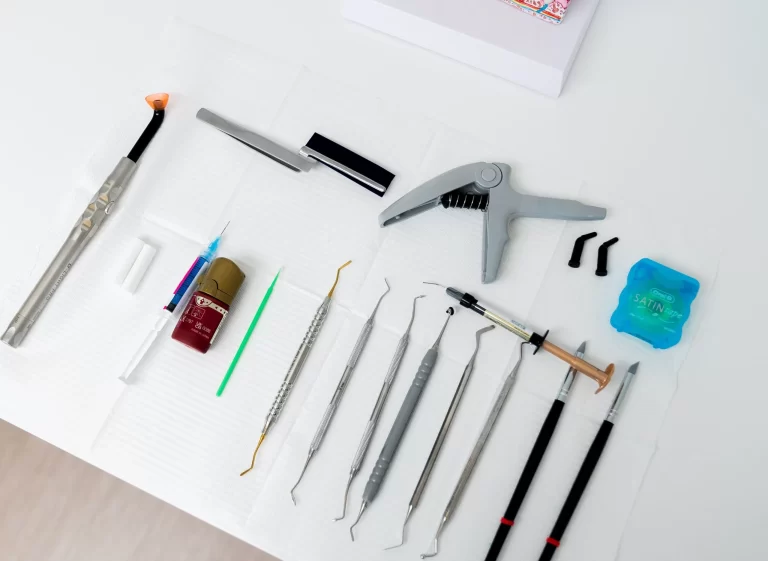 Dentist examining female patient's teeth